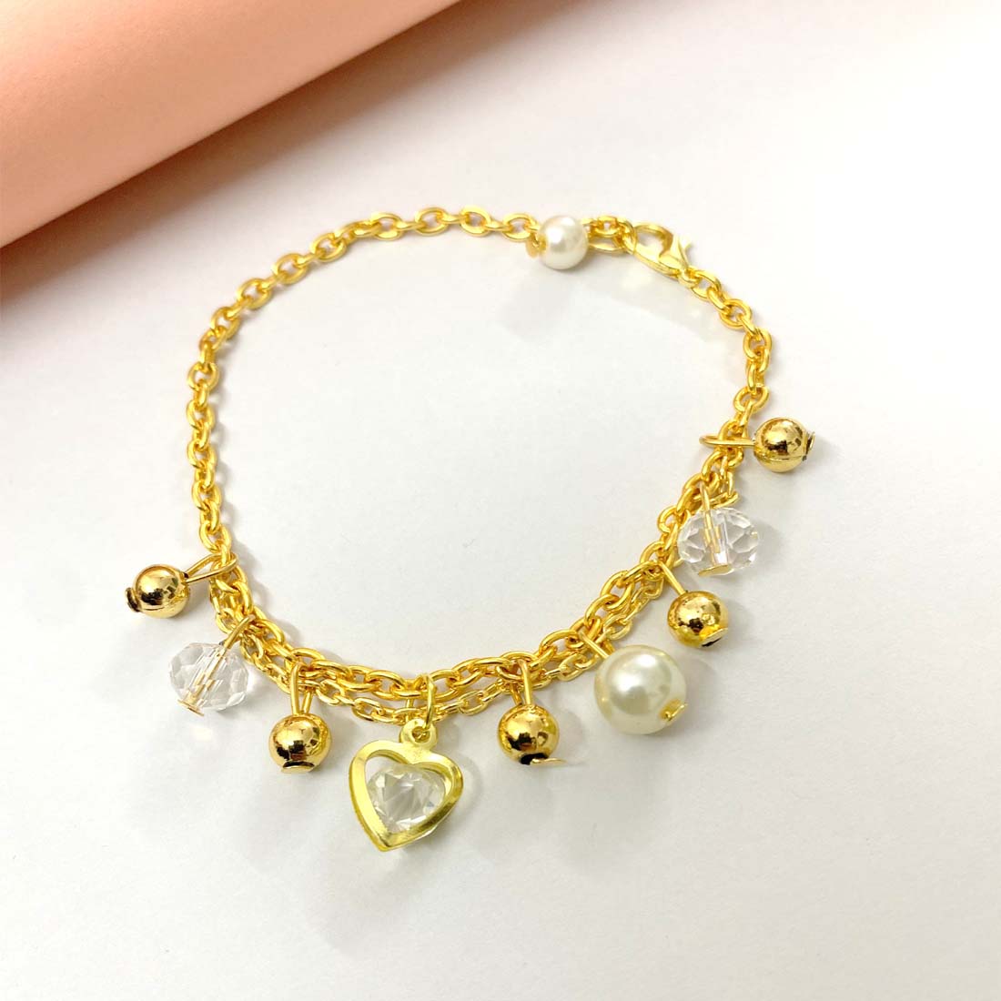 White Pearl Heart Gold Tone Charm Bracelet